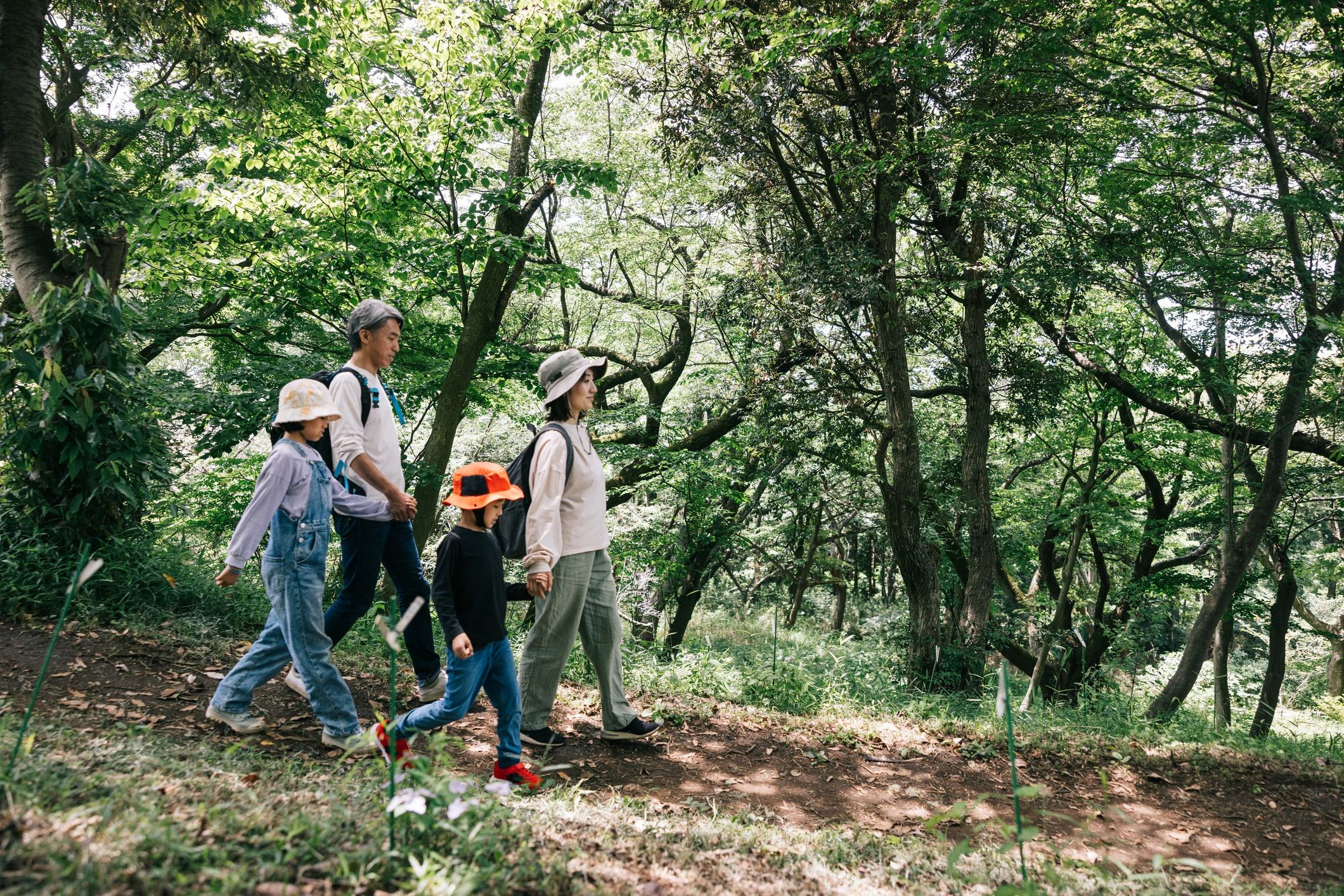 Family hiking together in nature during a retreat